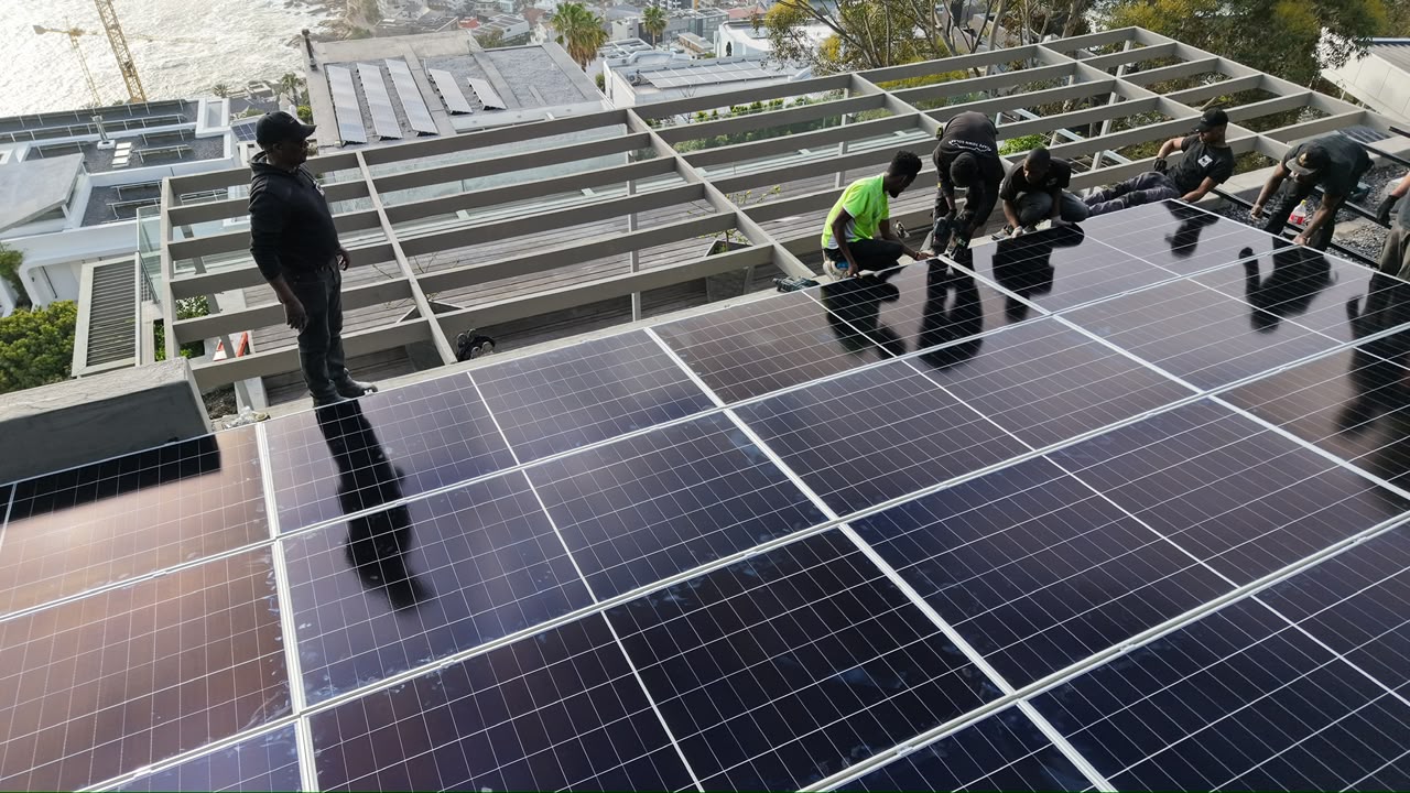 The Sun Savings install crew working on a rooftop array